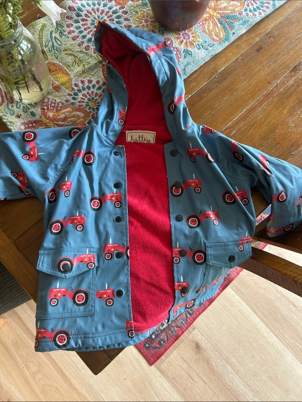 Hatley Blue Raincoat with Red Tractor Print and Red Lining